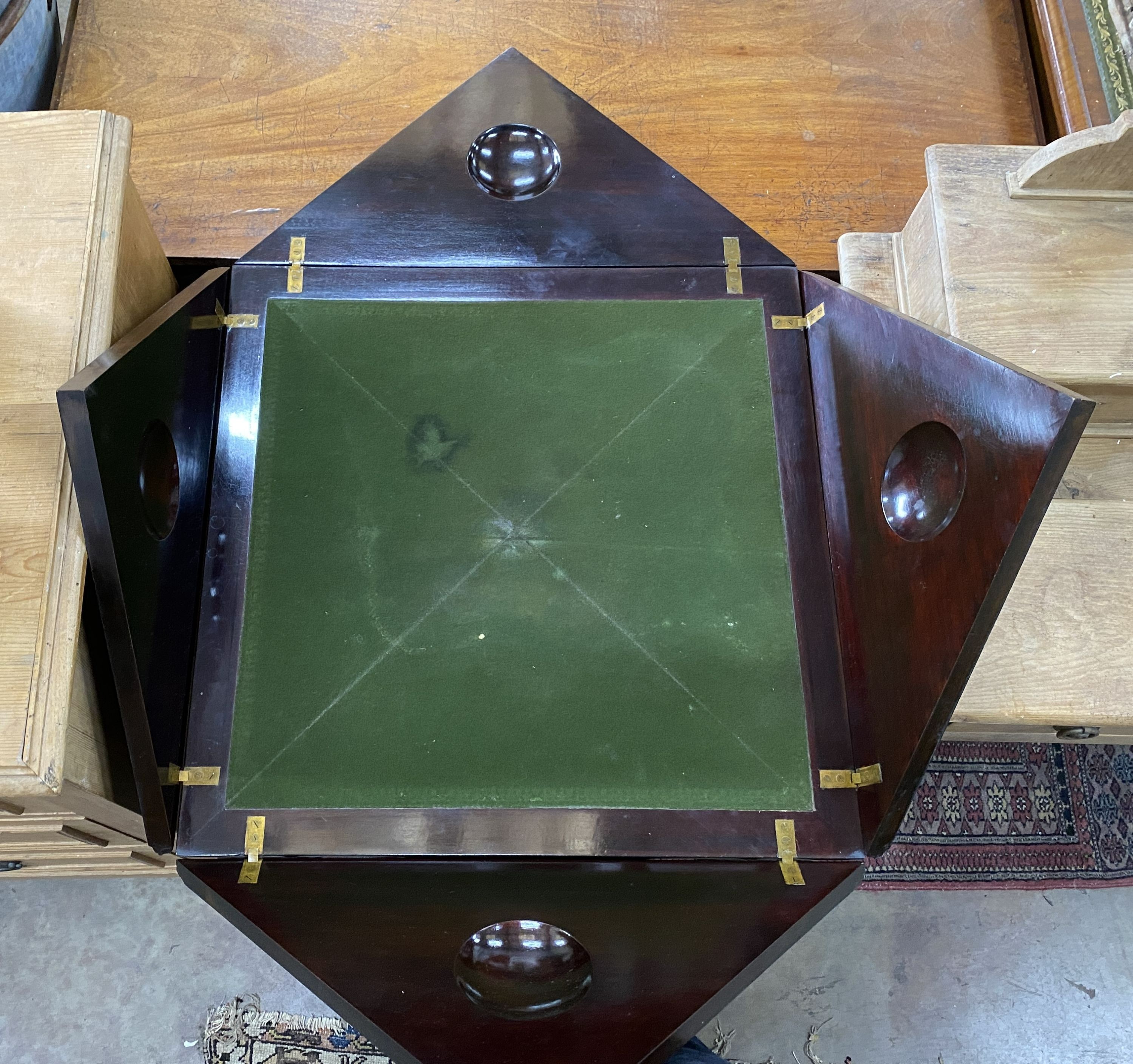 An Edwardian ebonised envelope card table, width 58cm height 74cm